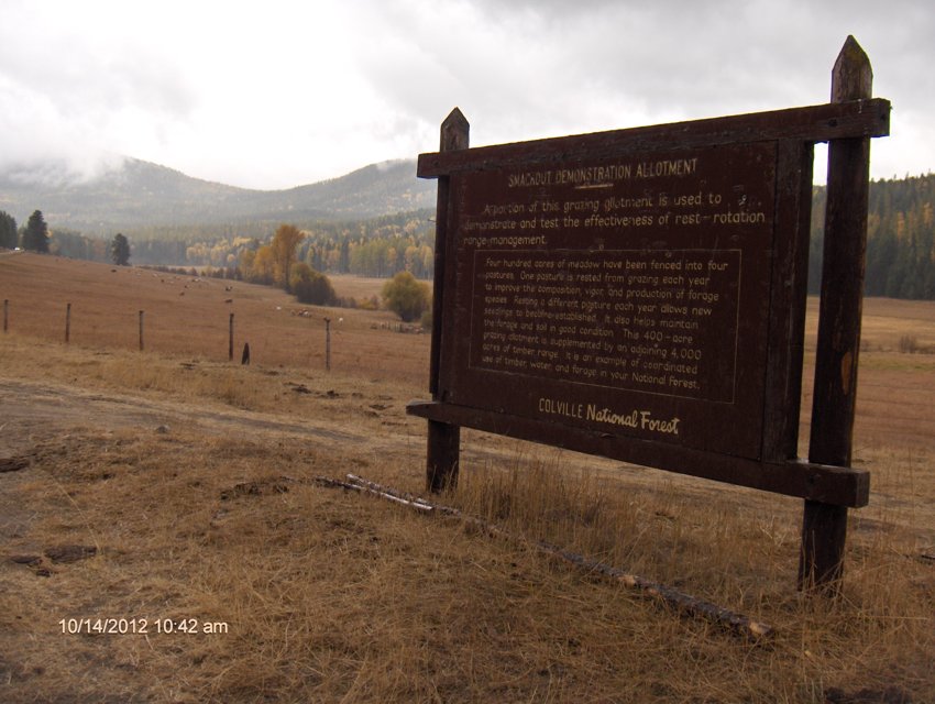 A wood commemorative sign to the cooperation between ranchers and government.