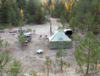 Looking down at the camp rear, tent and Jeep right after a shower